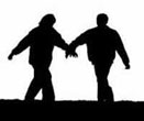 silhouette of Couple Walking Holding Hands