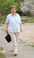 Middle Aged Woman Walking On Path