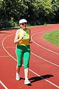 Senior Woman Power Walking On Track