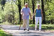 senior couple walking with canes