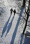 Couple Holding Hands Walking In Winter